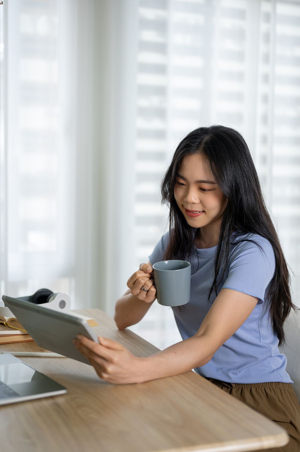 beautiful-asian-woman-watching-her-tablet (1)